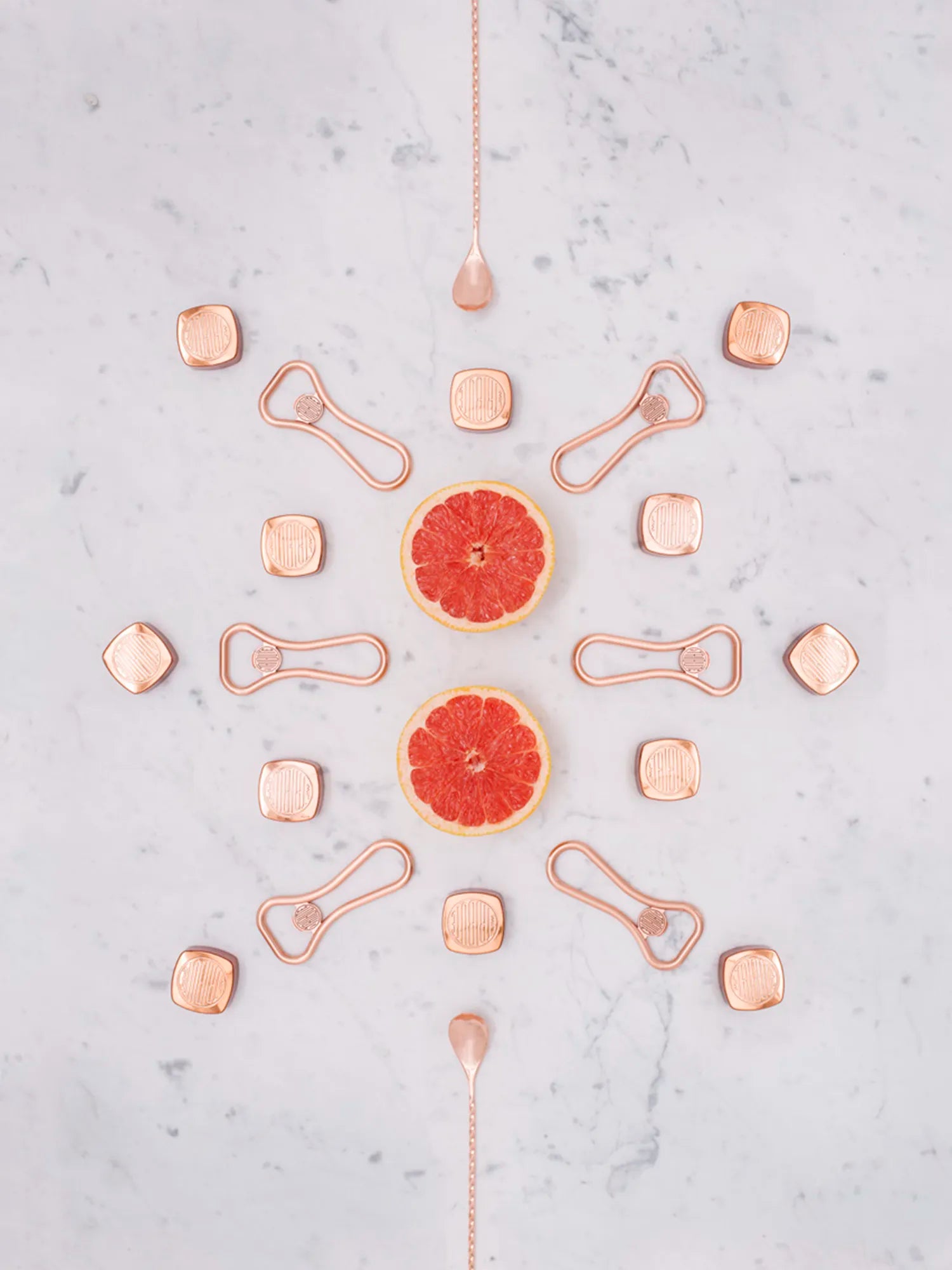 Art deco inspired bar tools and fresh grapefruit, styled by LE Tribute for premium cocktail crafting