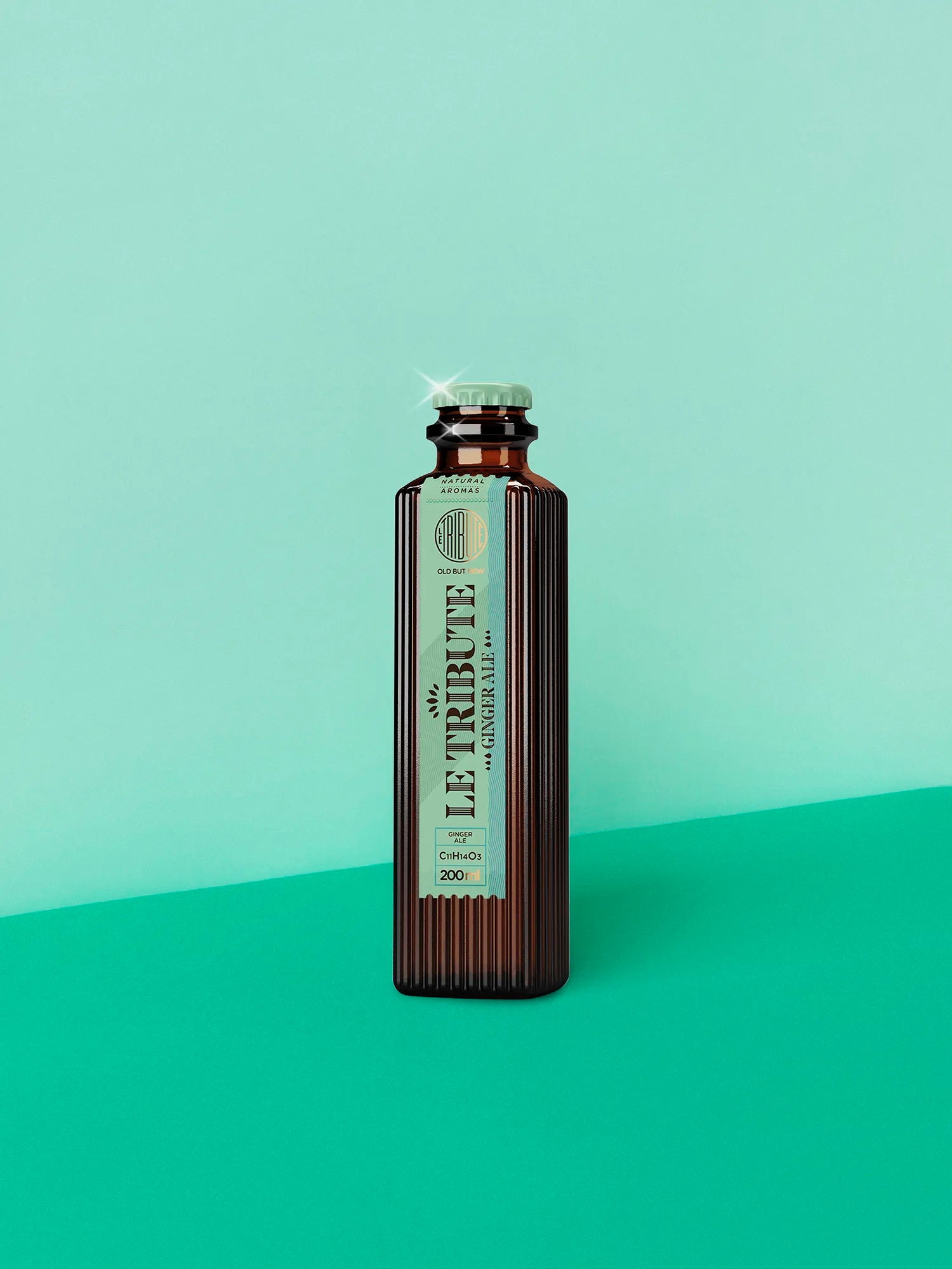 LE Tribute Ginger Ale 200ml bottle, crafted with natural ginger aroma and the signature ribbed glass design on a turquoise background