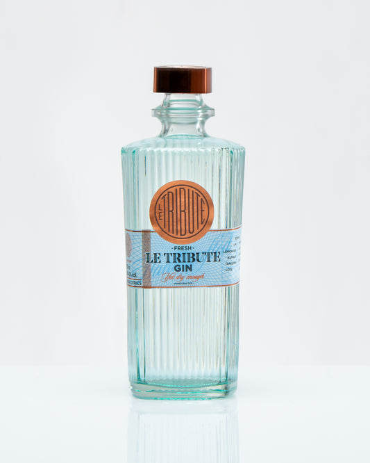 Bottle of Le Tribute Gin on a white background