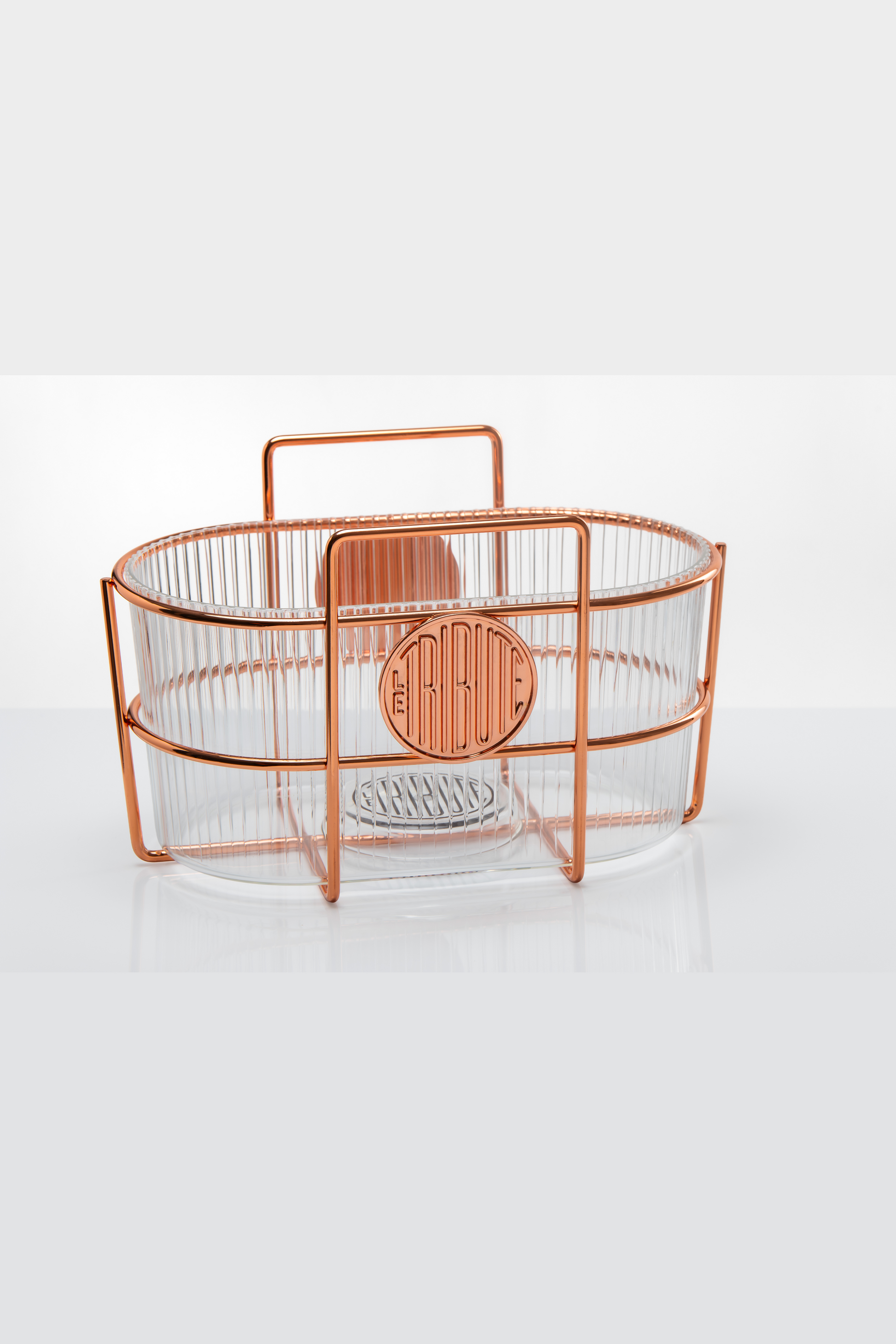 Copper wire basket with a handle on a white background