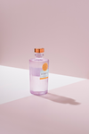 LE Tribute Mezcal: Minimalist shot of the lilac-tinted glass bottle with signature ribbed texture and branding