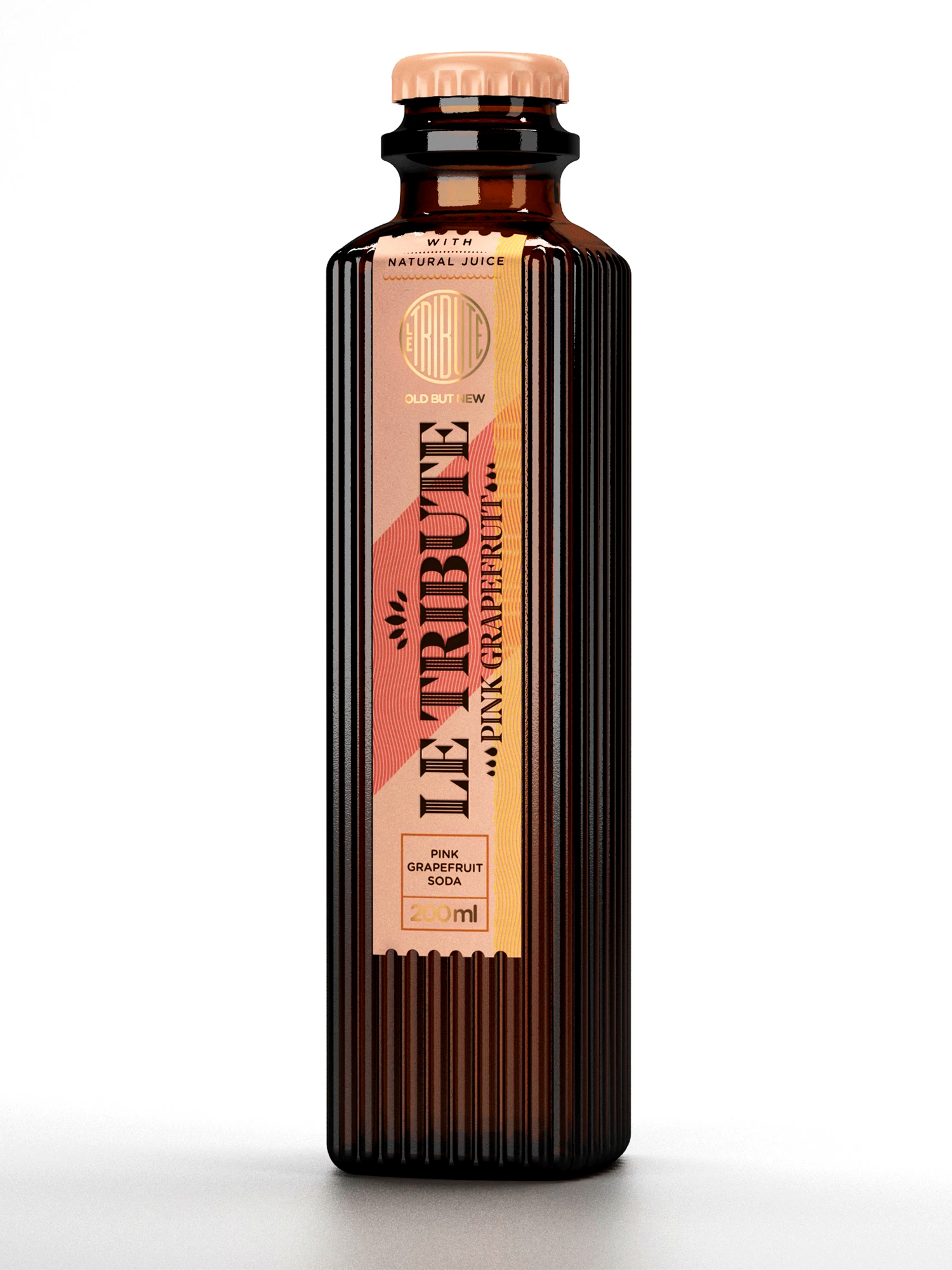 Close-up of LE Tribute Pink Grapefruit Soda bottle label, highlighting natural pink grapefruit juice and brand details